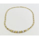 A 9ct yellow and white gold X link necklace, 43cm