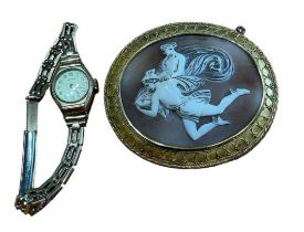 A Greek revival oval shell cameo brooch, depicting