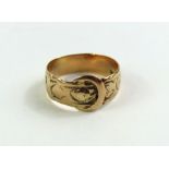 A 9ct gold buckle ring with engraved decoration, f