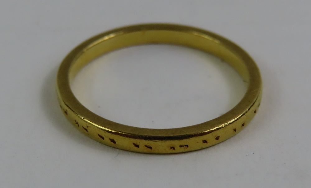 A 22ct gold wedding band, with worn pattern, finge - Image 2 of 4