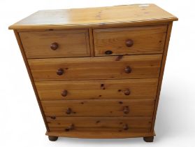 A contemporary orange pine chest of drawers, compr