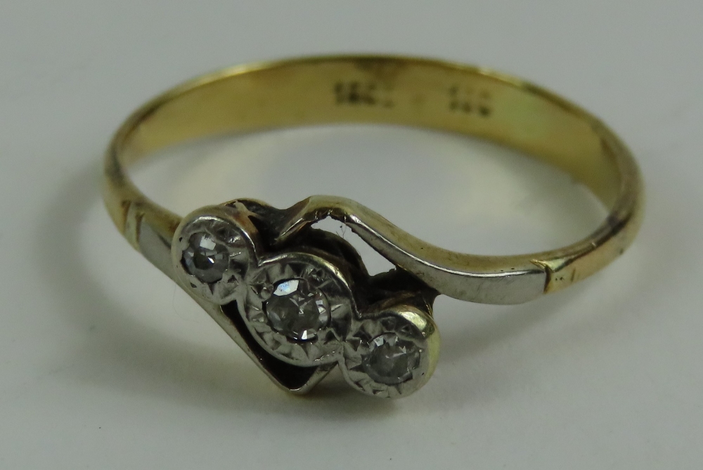 A diamond three stone twist ring, marked '18ct 18c - Image 2 of 4