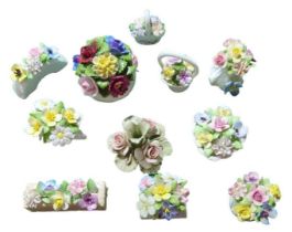 Eleven flower encrusted ornaments by Royal Doulton