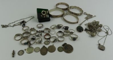 A collection of silver and white metal jewellery,