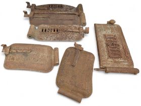 Six various cast iron grill oven plates including