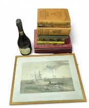 Collection of books, a bottle
