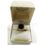 A 9ct gold black onyx set signet ring, finger size