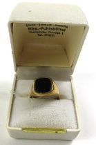 A 9ct gold black onyx set signet ring, finger size
