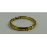 A 22ct gold wedding band, with worn pattern, finge