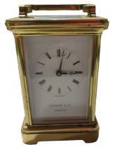 A brass cased carriage timepiece the white enamel