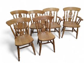 Six pine Windsor dining chairs including 2 carvers