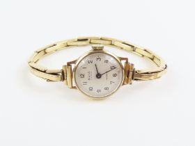 A ladies Avia watch face with 9ct gold case, on a