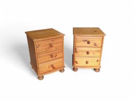 A pair of contemporary orange pine bedside cabinets