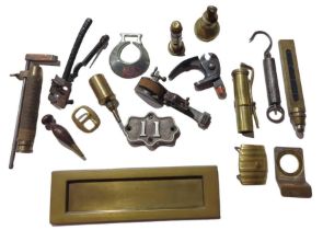 A brass letter slot, a brass cycle gun, various ha