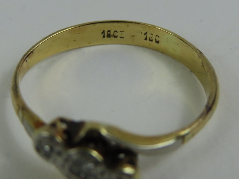 A diamond three stone twist ring, marked '18ct 18c - Image 3 of 4