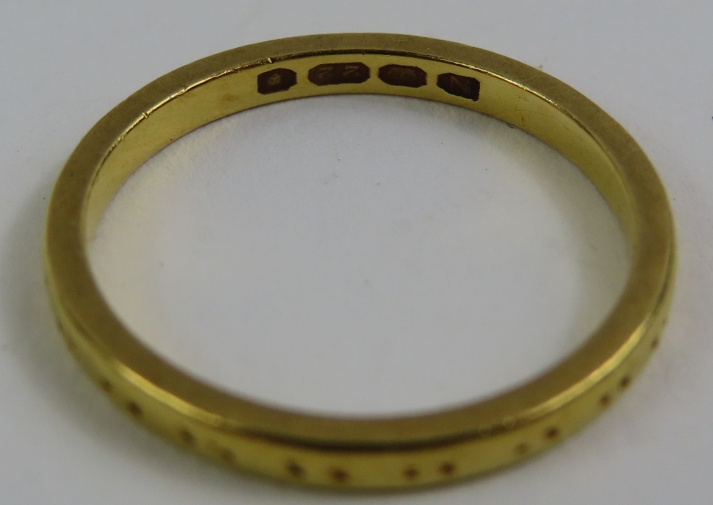 A 22ct gold wedding band, with worn pattern, finge - Image 3 of 4