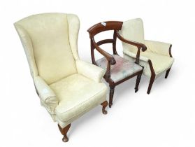 A George III style wing armchair, upholstered in a