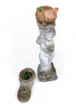 A reconstituted stone statue of a cherub, a model