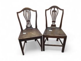 Two Georgian “Hepplewhite” elm dining chairs
