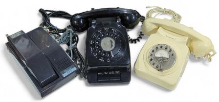 A vintage black cased telephone, a cream cased dia