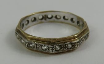 A two colour full eternity ring, marked '9ct', fin
