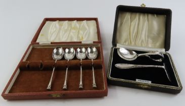 A silver babies pusher and feeder, and four silver