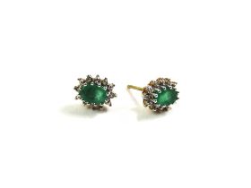 A pair of emerald and diamond cluster stud earring
