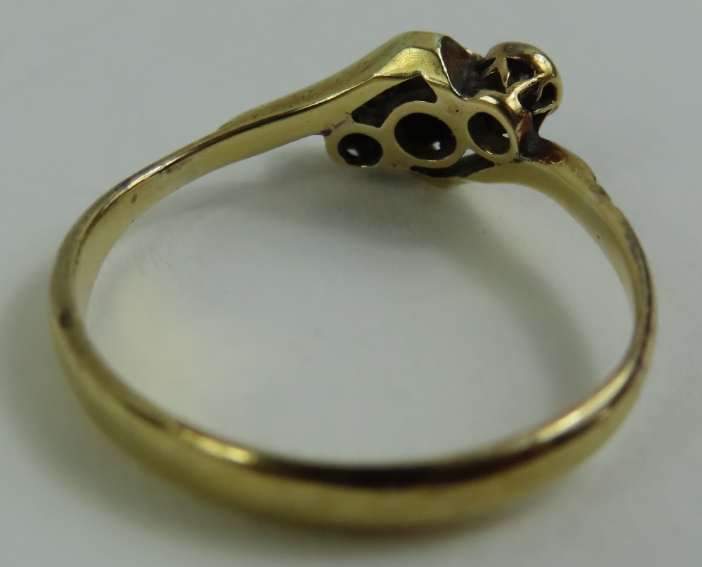 A diamond three stone twist ring, marked '18ct 18c - Image 4 of 4