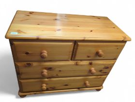 A contemporary orange pine chest of drawers, 90cm x