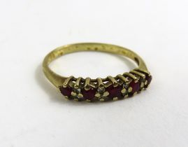 A 9ct gold ruby and diamond half eternity ring, fi