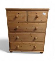 A contemporary pine chest of drawers, comprising t