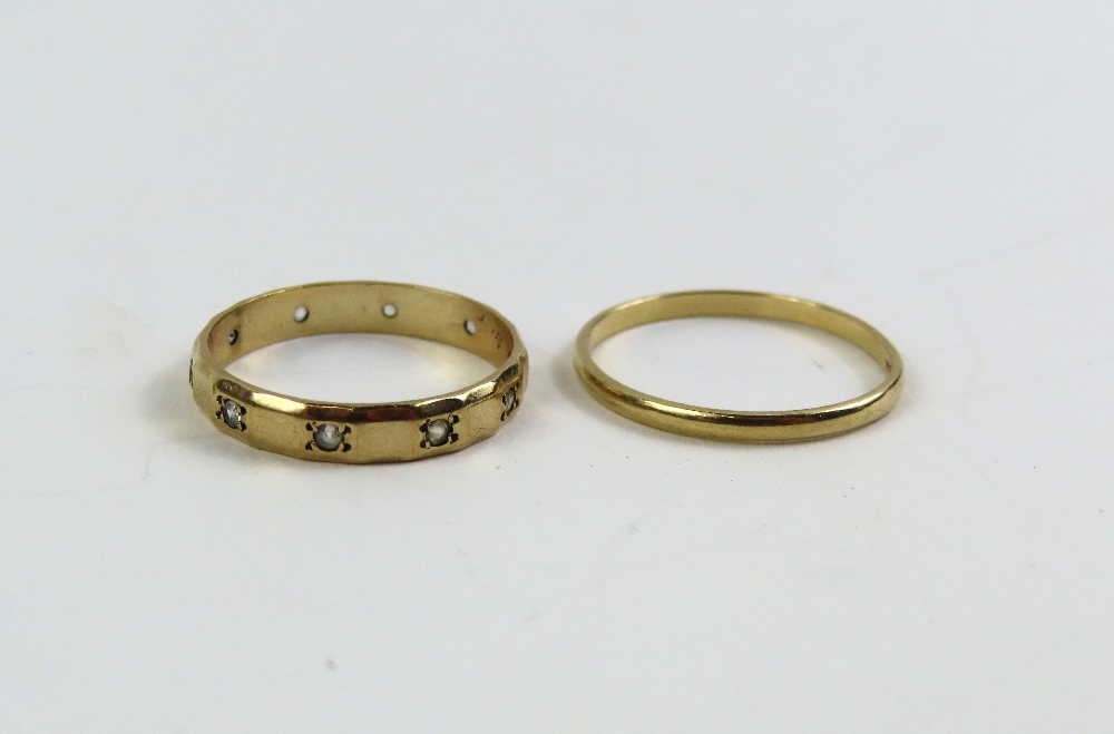 A 9ct gold wedding band, finger size Q 1/2, and a