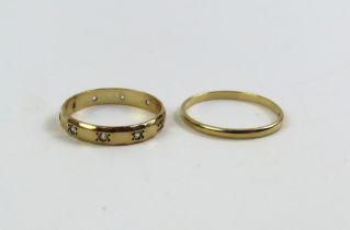 A 9ct gold wedding band, finger size Q 1/2, and a