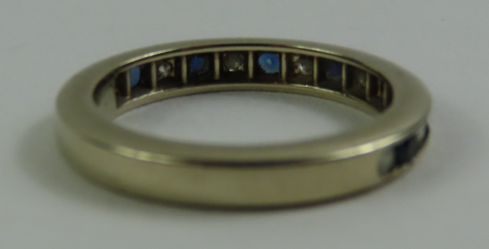 A channel set sapphire and diamond half eternity r - Image 2 of 5