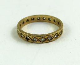 A 9ct gold white stone full eternity ring, finger