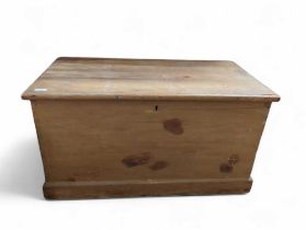 A pine blanket box with candle box and iron