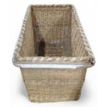 An industrial rectangular woven cane basket mounte