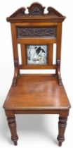 A Victorian red walnut hall chair the back set wit