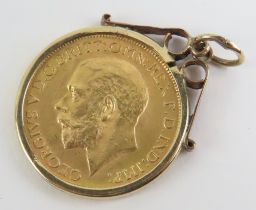 A King George V 1926 full sovereign in a plain 9ct