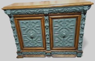 A 19th Century Continental carved oak cupboard fit