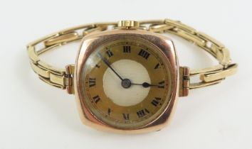An early to mid-20th century 9ct gold watch face,