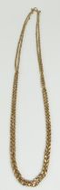 A gold fancy link guard chain, later doubled, with