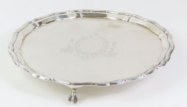 A George V circular silver salver centred with hus