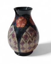 A Moorcroft pottery vase with lattice panel and fl