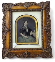 A Victorian ambrotype portrait of a young woman se