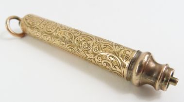 A gold propelling pencil, with foliate engraved de