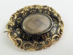 A 19th century mourning brooch, the front with hai