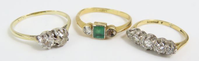 An emerald and diamond three stone ring, marked '1