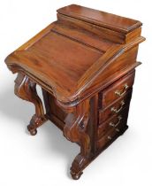 A mahogany Davenport the top with hinged cover, th