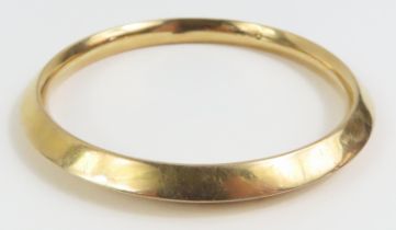 A 9ct gold bangle, with pointed profile, internal